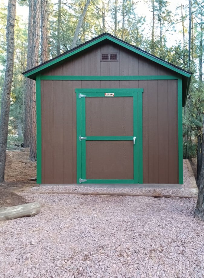 Brown Tuff Shed building with green trim